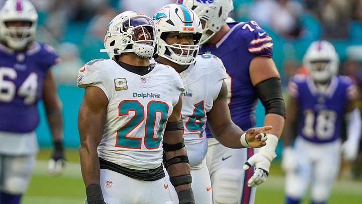 Miami Dolphins linebacker Jordyn Brooks (20) and defensive tackle Jordan Phillips (94) celebrate a fourth-down stop against the Buffalo Bills during the fourth quarter at Hard Rock Stadium in 2025. Miami Dolphins linebacker Jordyn Brooks (20) and defensive tackle Jordan Phillips (94) celebrate a fourth-down stop against the Buffalo Bills during the fourth quarter at Hard Rock Stadium in 2025.