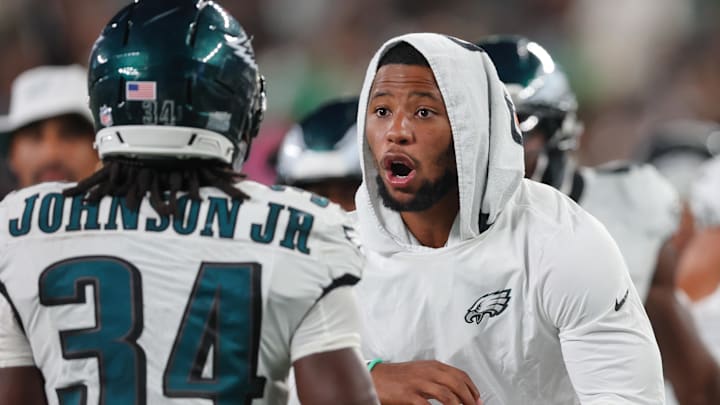 Aug 22, 2025; East Rutherford, New Jersey, USA; Philadelphia Eagles running back Montrell Johnson Jr. (34) is greeted by running back Saquon Barkley (26) after scoring a rushing touchdown during the second half against the New York Jets at MetLife Stadium. Mandatory Credit: Vincent Carchietta-Imagn Images Aug 22, 2025; East Rutherford, New Jersey, USA; Philadelphia Eagles running back Montrell Johnson Jr. (34) is greeted by running back Saquon Barkley (26) after scoring a rushing touchdown during the second half against the New York Jets at MetLife Stadium. Mandatory Credit: Vincent Carchietta-Imagn Images