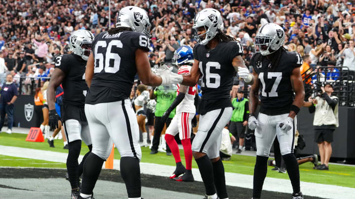 Nov 5, 2023; Paradise, Nevada, USA; Las Vegas Raiders wide receiver Jakobi Meyers (16) celebrates with Las Vegas Raiders guard Dylan Parham (66) after scoring a touchdown against the New York Giants during the first quarter at Allegiant Stadium. Mandatory Credit: Stephen R. Sylvanie-USA TODAY Sports