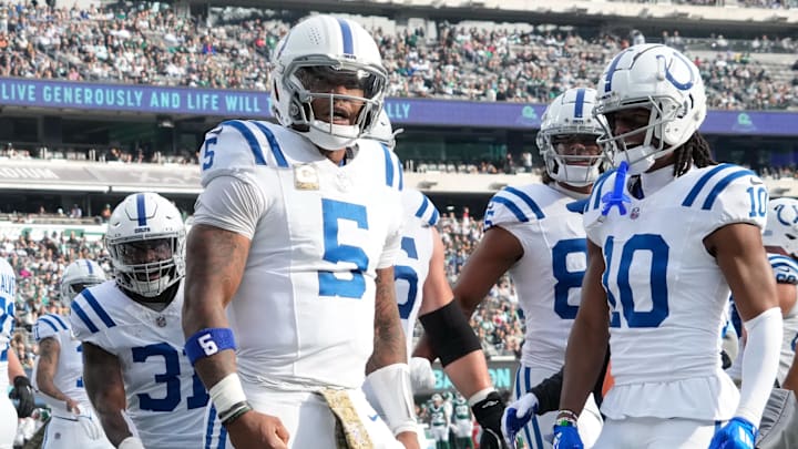 Nov 17, 2024; East Rutherford, New Jersey, USA; Indianapolis Colts quarterback Anthony Richardson (5) celebrates after scoring a touchdown over the New York Jets in the first half at MetLife Stadium. Mandatory Credit: Robert Deutsch-Imagn Images