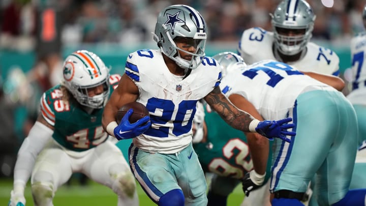 Dec 24, 2023; Miami Gardens, Florida, USA; Dallas Cowboys running back Tony Pollard (20) runs the ball against the Miami Dolphins during the second half at Hard Rock Stadium.