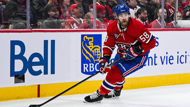 Montreal Canadiens defenseman David Savard plays the puck near the boards against the Chicago Blackhawks.