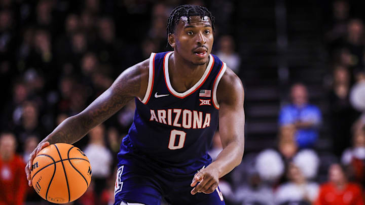 Jan 4, 2025; Cincinnati, Ohio, USA; Arizona Wildcats guard Jaden Bradley (0) dribbles against the Cincinnati Bearcats in the first half at Fifth Third Arena. Mandatory Credit: Katie Stratman-Imagn Images Jan 4, 2025; Cincinnati, Ohio, USA; Arizona Wildcats guard Jaden Bradley (0) dribbles against the Cincinnati Bearcats in the first half at Fifth Third Arena. Mandatory Credit: Katie Stratman-Imagn Images