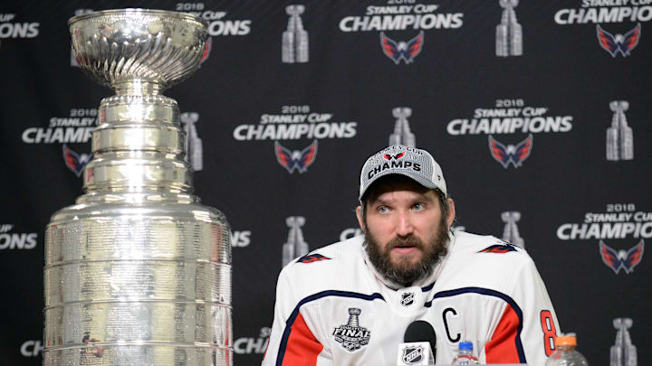 Washington Capitals left wing Alex Ovechkin speaks with media with the Stanley Cup displayed following the victory against the Vegas Golden Knights