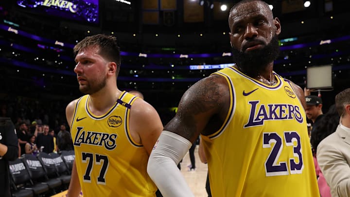 Apr 22, 2025; Los Angeles, California, USA; Los Angeles Lakers guard Luka Doncic (77) and Los Angeles Lakers forward LeBron James (23) leave a court after defeating the Minnesota Timberwolves 94-85 in game two of first round for the 2024 NBA Playoffs at Crypto.com Arena. Mandatory Credit: Kiyoshi Mio-Imagn Images