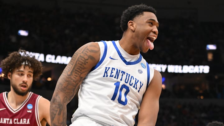 Mar 20, 2026; St. Louis, MO, USA; Kentucky Wildcats forward Brandon Garrison (10) reacts after dunking the ball against Santa Clara Broncos forward Allen Graves (22) during the second half of a first round game of the men's 2026 NCAA Tournament at Enterprise Center. Mandatory Credit: Jeff Curry-Imagn Images