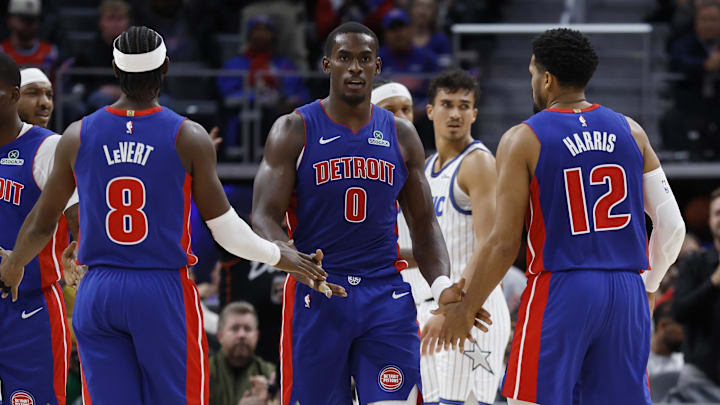 Oct 29, 2025; Detroit, Michigan, USA; Detroit Pistons center Jalen Duren (0) receives congratulations from guard Caris LeVert (8) and forward Tobias Harris (12) in the first half against the Orlando Magic at Little Caesars Arena. Mandatory Credit: Rick Osentoski-Imagn Images