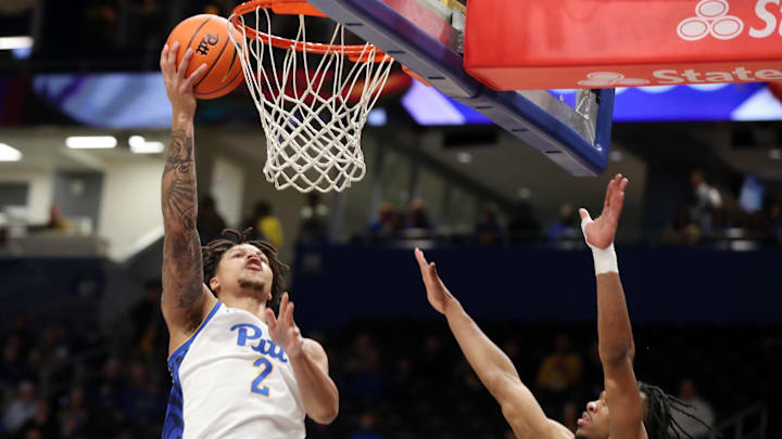 Mar 8, 2025; Pittsburgh, Pennsylvania, USA; Pittsburgh Panthers forward Cameron Corhen (2) shoots against Boston College Eagles guard Donald Hand Jr. (13) during the first half at the Petersen Events Center. Mandatory Credit: Charles LeClaire-Imagn Images Mar 8, 2025; Pittsburgh, Pennsylvania, USA; Pittsburgh Panthers forward Cameron Corhen (2) shoots against Boston College Eagles guard Donald Hand Jr. (13) during the first half at the Petersen Events Center. Mandatory Credit: Charles LeClaire-Imagn Images