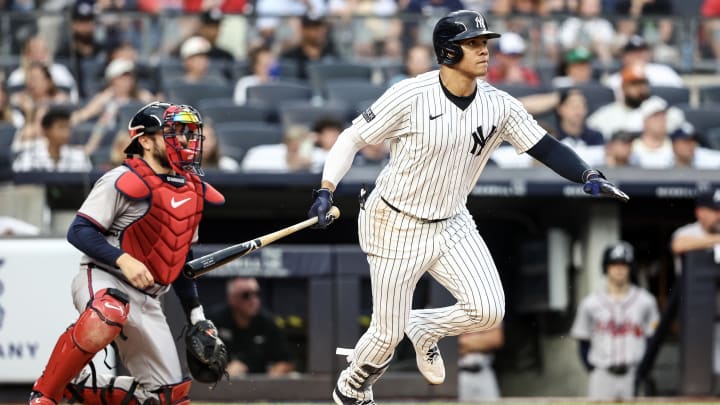 Jun 22, 2024; Bronx, New York, USA; New York Yankees right fielder Juan Soto (22) hits a single against the Atlanta Braves in the third inning at Yankee Stadium. 