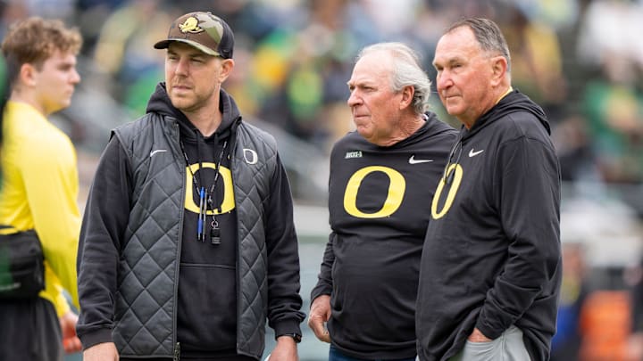 Oregon offensive coordinator Will Stein, left, former Oregon defensive coordinator Nick Aliotti and former Oregon coach Rich Brooks talk before the game as the Fighting Ducks face off against Mighty Oregon in the Oregon Ducks spring game on April 26, 2025, at Autzen Stadium in Eugene. Oregon offensive coordinator Will Stein, left, former Oregon defensive coordinator Nick Aliotti and former Oregon coach Rich Brooks talk before the game as the Fighting Ducks face off against Mighty Oregon in the Oregon Ducks spring game on April 26, 2025, at Autzen Stadium in Eugene.