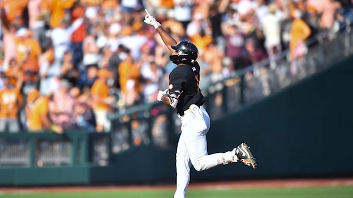 Tennessee's Christian Moore (1) celebrates while running the bases after hitting a home run during game three of the NCAA College World Series finals between Tennessee and Texas A&M at Charles Schwab Field in Omaha, Neb., on Monday, June 24, 2024.