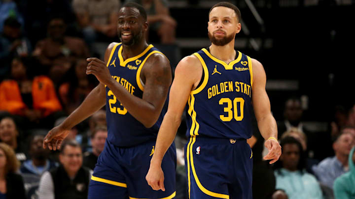 Golden State Warriors forward Draymond Green (23) and guard Stephen Curry (30) react during the second half against the Memphis Grizzlies at FedExForum.