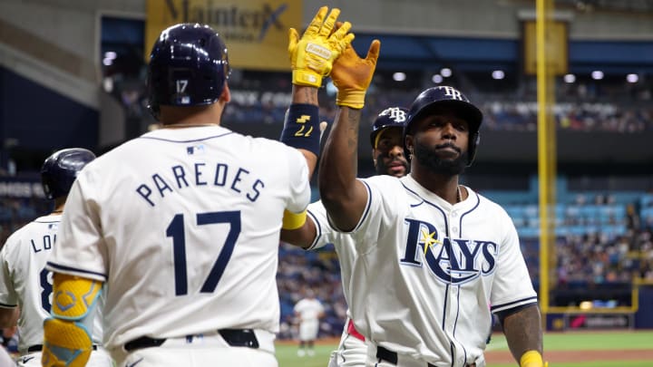 Jul 11, 2024; St. Petersburg, Florida, USA; Tampa Bay Rays third baseman Isaac Paredes (17) congratulates outfielder Randy Arozarena (56) after hitting a two-run home run against the New York Yankees in the first inning at Tropicana Field.