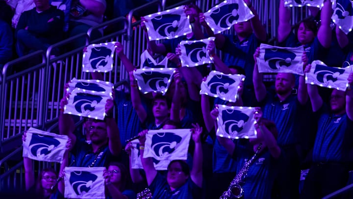 Mar 7, 2026; Kansas City, MO, USA;  Members of the Kansas State Wildcats hold lighted towels during the first half against the TCU Horned Frogs at T-Mobile Center. Mandatory Credit: Nick Tre. Smith-Imagn Images