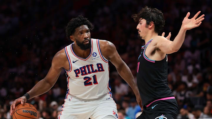 Mar 30, 2026; Miami, Florida, USA; Philadelphia 76ers center Joel Embiid (21) drives to the basket against Miami Heat forward Jaime Jaquez Jr. (11) during the third quarter at Kaseya Center. Mandatory Credit: Sam Navarro-Imagn Images