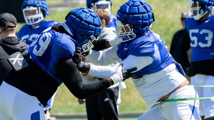University of Kentucky offensive linebacker practices against offensive linebacker Malachi Wood during spring football practice on Saturday, April 6, 2024. University of Kentucky offensive linebacker practices against offensive linebacker Malachi Wood during spring football practice on Saturday, April 6, 2024.