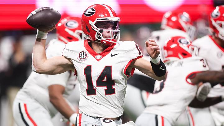 Dec 6, 2025; Atlanta, GA, USA; Georgia Bulldogs quarterback Gunner Stockton (14) throws a pass during the fourth quarter against the Alabama Crimson Tide during the 2025 SEC Championship game at Mercedes-Benz Stadium. Mandatory Credit: Brett Davis-Imagn Images
