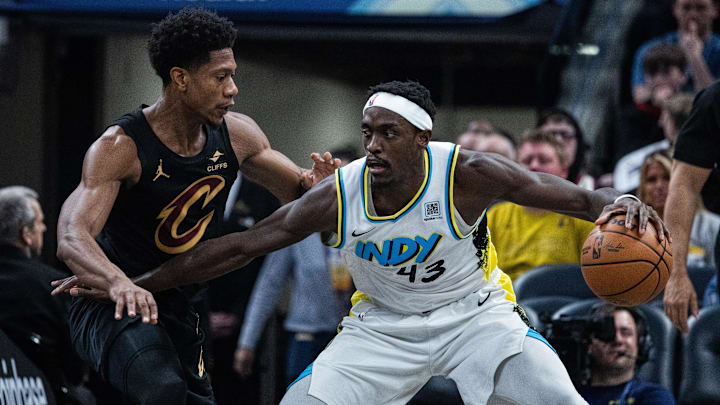 Apr 10, 2025; Indianapolis, Indiana, USA; Indiana Pacers forward Pascal Siakam (43) dribbles the ball while Cleveland Cavaliers forward De'Andre Hunter (12) defends in the first half at Gainbridge Fieldhouse. Mandatory Credit: Trevor Ruszkowski-Imagn Images