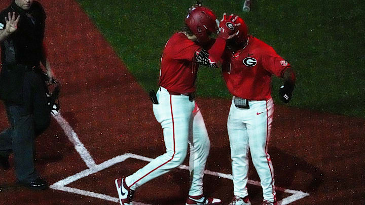 GeorgiaÕs Henry Hunter (11) celebrates after scoring a home run during a NCAA baseball game against Kentucky on March 14, 2025.