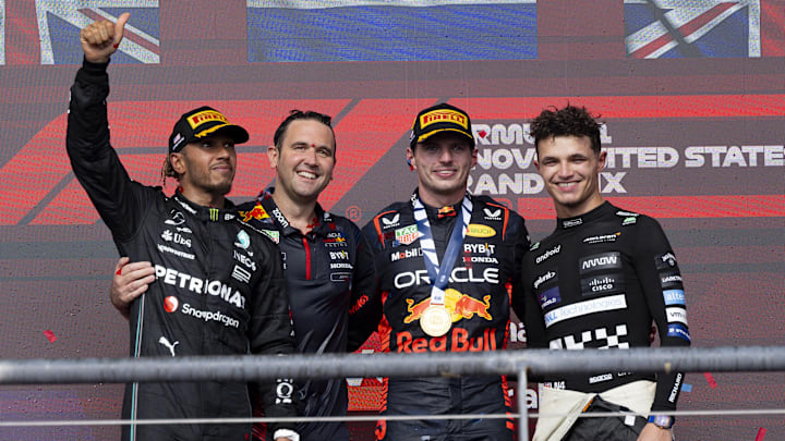 Oct 22, 2023; Austin, Texas, USA; Mercedes AMG Petronas Motorsport driver Lewis Hamilton (44) of Team Great Britain and Red Bull Racing Honda driver Max Verstappen (1) of Team Netherlands and McLaren F1 driver Lando Norris (4) of Team Great Britain smile and wave to the crowd after the 2023 United States Grand Prix at Circuit of the Americas. Mandatory Credit: Jerome Miron-Imagn Images