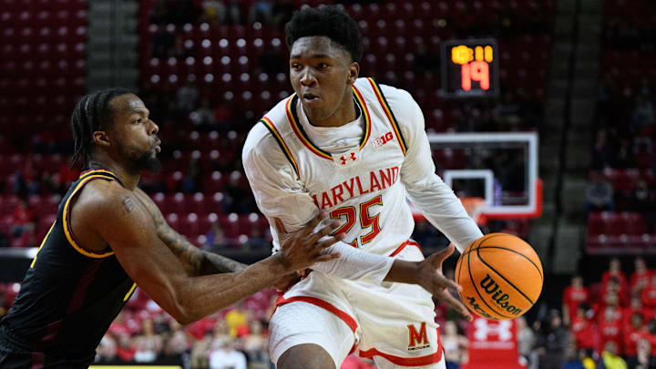 Maryland Terrapins center Derik Queen (25) drives to the basket during the second half against Minnesota Golden Gophers guard Femi Odukale (11) at Xfinity Center.