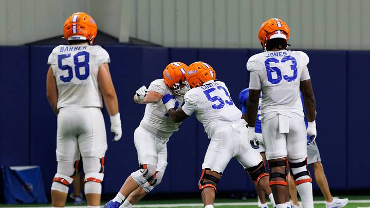 Florida Gators offensive lineman Bryce Lovett (53) participates in a drill while Florida Gators offensive lineman Austin Barber (58) and Florida Gators offensive lineman Caden Jones (63) watch during fall football practice at Sanders Indoor Practice Fields at the University of Florida in Gainesville, FL on Thursday, August 7, 2025. [Matt Pendleton/Gainesville Sun]