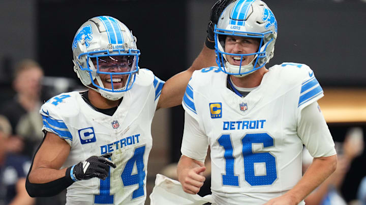 Detroit Lions receiver Amon-Ra St. Brown (14) and quarterback Jared Goff (16) celebrate after completing a hook and ladder play for a touchdown to teammate Jahmyr Gibbs (not pictured) during their game against the Arizona Cardinals at State Farm Stadium in Glendale, Ariz., Sep 22, 2024. Detroit Lions receiver Amon-Ra St. Brown (14) and quarterback Jared Goff (16) celebrate after completing a hook and ladder play for a touchdown to teammate Jahmyr Gibbs (not pictured) during their game against the Arizona Cardinals at State Farm Stadium in Glendale, Ariz., Sep 22, 2024.