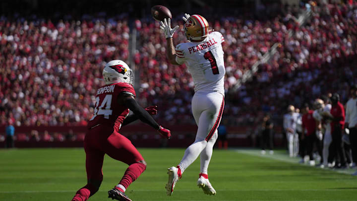 Sep 21, 2025; Santa Clara, California, USA; San Francisco 49ers wide receiver Ricky Pearsall (1) makes the catch inform of Arizona Cardinals safety Jalen Thompson (34) during the second half at Levi's Stadium. Mandatory Credit: Cary Edmondson-Imagn Images