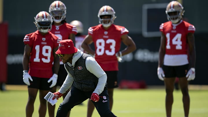 Jun 11, 2025; Santa Clara, CA, USA; San Francisco 49ers wide receiver coach Leonard Hankerson (in hat) works with his receivers during a team OTA at Levi's Stadium. Mandatory Credit: D. Ross Cameron-Imagn Images