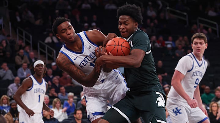 Nov 18, 2025; New York, New York, USA; Kentucky Wildcats forward Brandon Garrison (10) and Michigan State Spartans forward Cameron Ward (3) battle for a rebound during the first half at Madison Square Garden. Mandatory Credit: Vincent Carchietta-Imagn Images