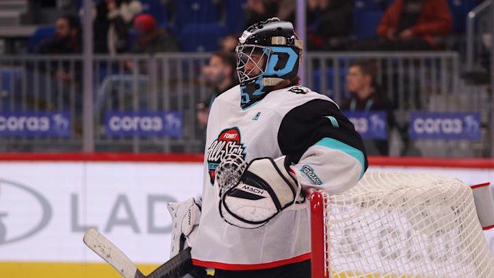 Div. Tarasova Hockey Club player, Alexei Kolosov (1) seen in...