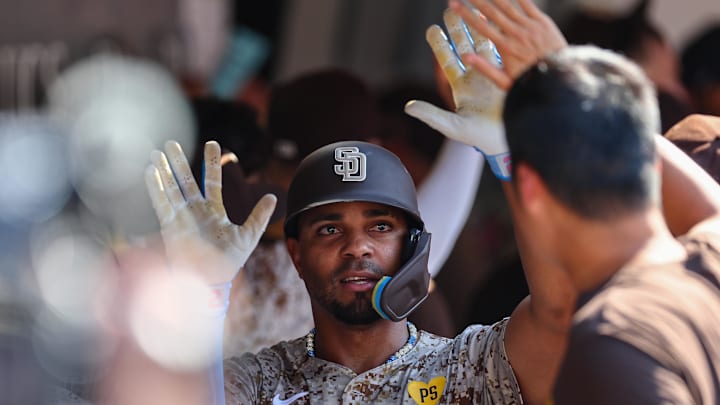 Sep 8, 2024; San Diego, California, USA; San Diego Padres second baseman Xander Bogaerts (2) celebrates with teammates after hitting a two run home run during the eighth inning against the San Francisco Giants at Petco Park. Mandatory Credit: Chadd Cady-Imagn Images Sep 8, 2024; San Diego, California, USA; San Diego Padres second baseman Xander Bogaerts (2) celebrates with teammates after hitting a two run home run during the eighth inning against the San Francisco Giants at Petco Park. Mandatory Credit: Chadd Cady-Imagn Images