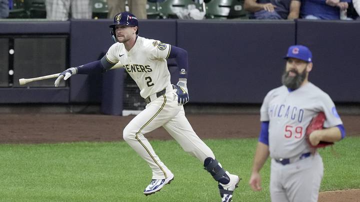 Oct 11, 2025; Milwaukee, Wisconsin, USA; Milwaukee Brewers second baseman Brice Turang (2) watches his solo home run off Chicago Cubs pitcher Andrew Kittredge (59) during the seventh inning during game five of the NLDS round for the 2025 MLB playoffs at American Family Field. Mandatory Credit: Mark Hoffman-USA TODAY Network via Imagn Images