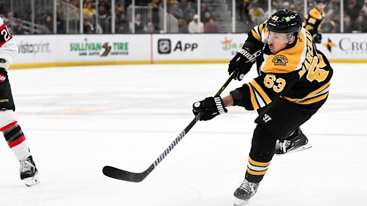 Jan 23, 2025; Boston, Massachusetts, USA; Boston Bruins left wing Brad Marchand (63) takes a shot against the Ottawa Senators during the first period at the TD Garden. Mandatory Credit: Brian Fluharty-Imagn Images