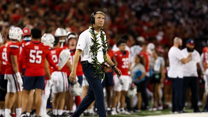 Sep 7, 2024; Tucson, Arizona, USA; Arizona Wildcats head coach Brent Brennan looks at the scoreboard against the Northern Arizona Lumberjacks during the first quarter at Arizona Stadium. Sep 7, 2024; Tucson, Arizona, USA; Arizona Wildcats head coach Brent Brennan looks at the scoreboard against the Northern Arizona Lumberjacks during the first quarter at Arizona Stadium.