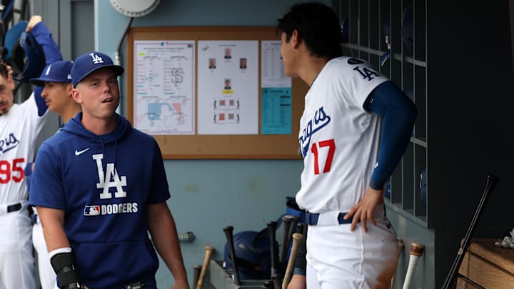 Sep 21, 2025; Los Angeles, California, USA; Los Angeles Dodgers injured catcher Will Smith (left) with his right hand in a brace talks with designated hitter Shohei Ohtani (17) during the eighth inning against the San Francisco Giants at Dodger Stadium. Mandatory Credit: Kiyoshi Mio-Imagn Images Sep 21, 2025; Los Angeles, California, USA; Los Angeles Dodgers injured catcher Will Smith (left) with his right hand in a brace talks with designated hitter Shohei Ohtani (17) during the eighth inning against the San Francisco Giants at Dodger Stadium. Mandatory Credit: Kiyoshi Mio-Imagn Images