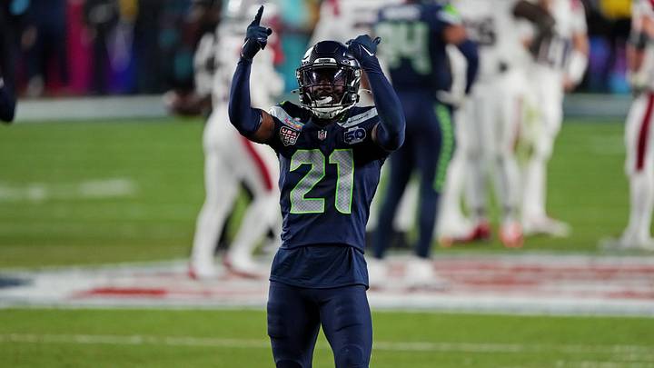 Seattle Seahawks cornerback Devon Witherspoon (21) celebrates after a play during the fourth quarter. Seattle Seahawks cornerback Devon Witherspoon (21) celebrates after a play during the fourth quarter.