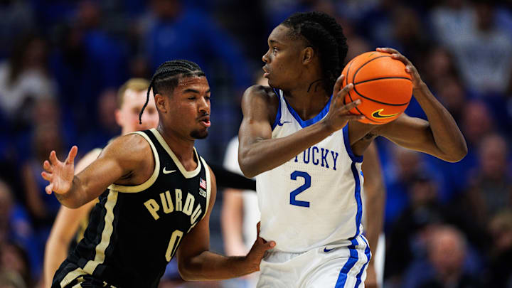Oct 24, 2025; Lexington, KY, USA; Kentucky Wildcats guard Jasper Johnson (2) handles the ball guarded by Purdue Boilermakers guard C.J. Cox (0) during the first half at Rupp Arena at Central Bank Center. Mandatory Credit: Jordan Prather-Imagn Images