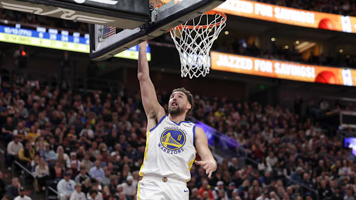 Feb 12, 2024; Salt Lake City, Utah, USA;  Golden State Warriors guard Klay Thompson (11) shoots a layup against the Jazz.