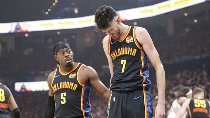 May 5, 2025; Oklahoma City, Oklahoma, USA; Oklahoma City Thunder guard Luguentz Dort (5) checks on forward Chet Holmgren (7) after he was hit during a play against the Denver Nuggets during the first quarter during game one of the second round for the 2025 NBA Playoffs at Paycom Center. Mandatory Credit: Alonzo Adams-Imagn Images
