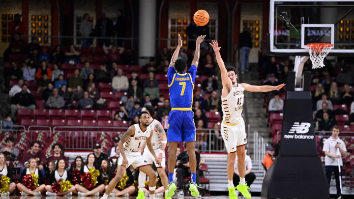 Mar 2, 2024; Chestnut Hill, Massachusetts, USA; Pittsburgh Panthers guard Carlton Carrington (7) shoots the ball over Boston College Eagles forward Quinten Post (12) during the second half at Conte Forum. Mandatory Credit: Eric Canha-USA TODAY Sports