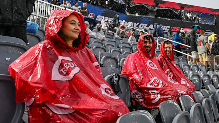 Aug 2, 2025; Bristol, Tennessee, USA; Fans look on as rain delays the start of the Speedway Classic game between the Cincinnati Reds and the Atlanta Braves at Bristol Motor Speedway. Mandatory Credit: Bryan Lynn-Imagn Images