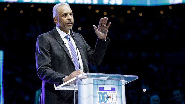 Mar 19, 2026; Charlotte, North Carolina, USA; Dell Curry addresses the crowd during the ceremony to retire his Charlotte Hornets jersey during halftime of the game against the Orlando Magic at Spectrum Center. Mandatory Credit: Brian Westerholt-Imagn Images Mar 19, 2026; Charlotte, North Carolina, USA; Dell Curry addresses the crowd during the ceremony to retire his Charlotte Hornets jersey during halftime of the game against the Orlando Magic at Spectrum Center. Mandatory Credit: Brian Westerholt-Imagn Images