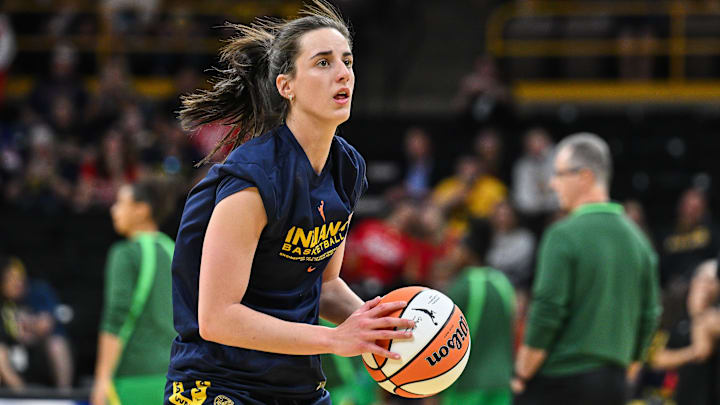 Indiana Fever guard Caitlin Clark warms up before the game against the Brazil National Team at Carver-Haweye Arena.
