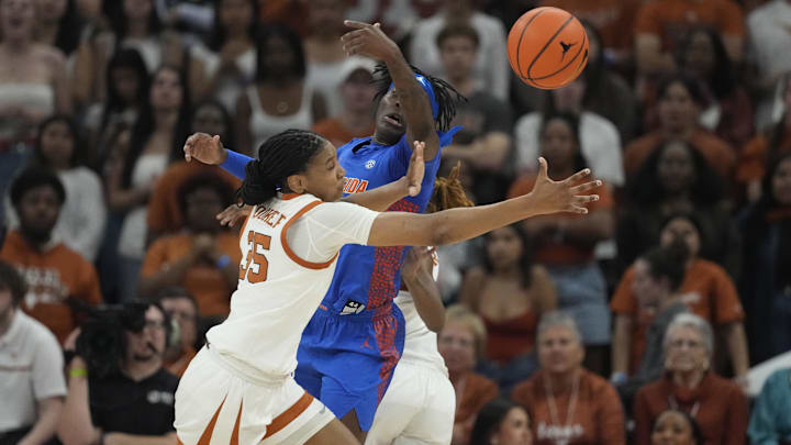 Mar 2, 2025; Austin, Texas, USA; Texas Longhorns forward Madison Booker (35) and Florida Gators forward Alexia Dizeko (9) battle for the loose ball during the first half at Moody Center. Mandatory Credit: Scott Wachter-Imagn Images