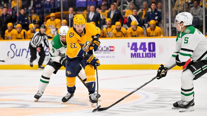 Oct 3, 2026; Nashville, Tennessee, USA; Nashville Predators center Mavrik Bourque (22) and Dallas Stars defenseman Nils Lundkvist (5) battle for the puck during the first period at Bridgestone Arena. Mandatory Credit: Steve Roberts-Imagn Images Oct 3, 2026; Nashville, Tennessee, USA; Nashville Predators center Mavrik Bourque (22) and Dallas Stars defenseman Nils Lundkvist (5) battle for the puck during the first period at Bridgestone Arena. Mandatory Credit: Steve Roberts-Imagn Images