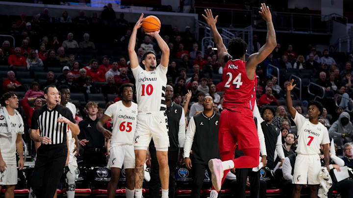 Cincinnati Bearcats guard Shon Abaev (10) shoots for three in the second half of the NCAA men’s basketball game between the Cincinnati Bearcats and the NJIT Highlanders at Fifth Third Arena in Cincinnati on Monday, Nov. 24, 2025. The Bearcats won 94-67. Cincinnati Bearcats guard Shon Abaev (10) shoots for three in the second half of the NCAA men’s basketball game between the Cincinnati Bearcats and the NJIT Highlanders at Fifth Third Arena in Cincinnati on Monday, Nov. 24, 2025. The Bearcats won 94-67.