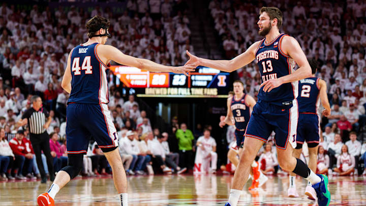 Feb 1, 2026; Lincoln, Nebraska, USA; Illinois Fighting Illini center Tomislav Ivisic (13) and center Zvonimir Ivisic (44) celebrate after a shot in the first half against the Nebraska Cornhuskers at Pinnacle Bank Arena. Mandatory Credit: Dylan Widger-Imagn Images