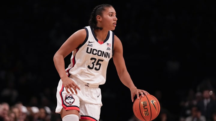 Dec 7, 2024; Brooklyn, New York, USA; Connecticut Huskies guard Azzi Fudd (35) dribbles during the first half against the Louisville Cardinals at Barclays Center. Mandatory Credit: Lucas Boland-Imagn Images