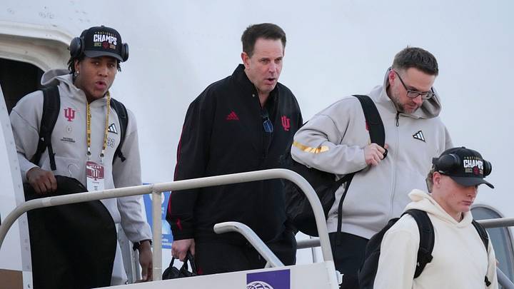 Indiana head coach Curt Cignetti walks off an airplane as his team returns home after beating Miami in the College Football Playoff national championship game on Tuesday, Jan. 20, 2026, in Indianapolis.